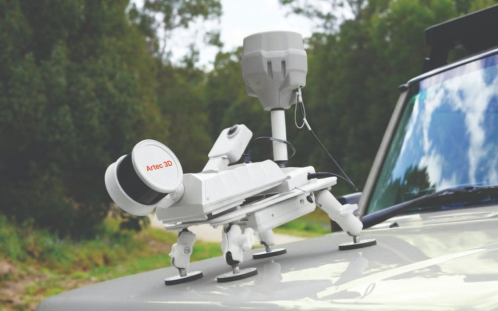 An Artec Jet SLAM LiDAR scanner mounted on a vehicle bonnet
