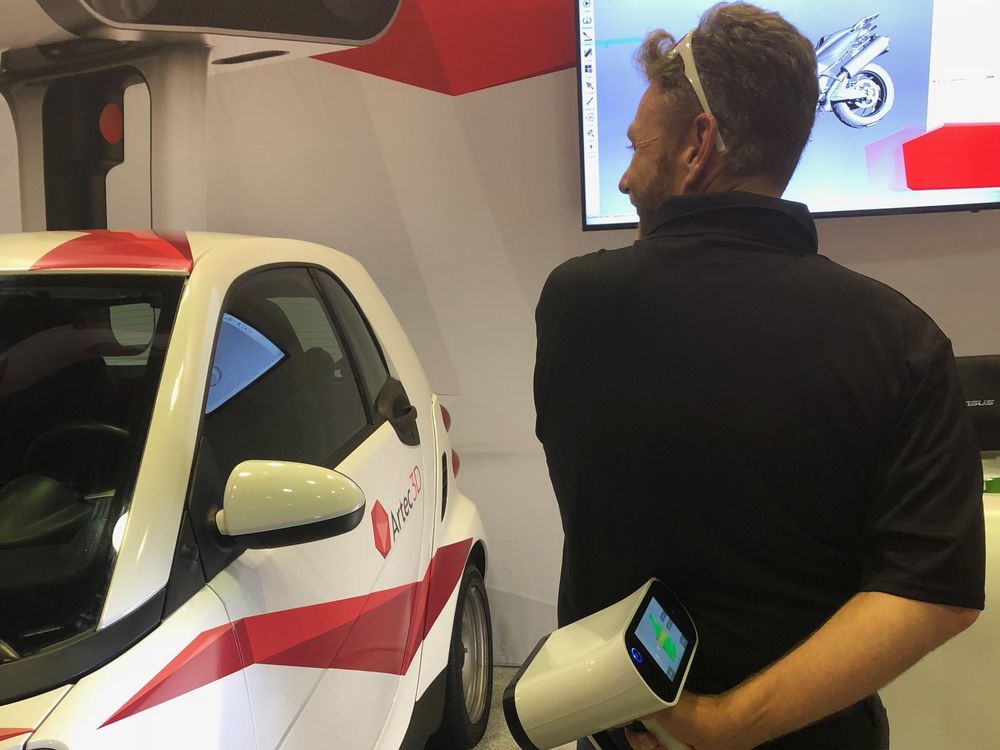 An Artec Leo scanning a car, one-handed