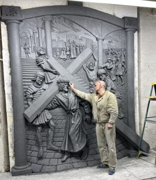 Tim Schmalz sculpting a relief panel